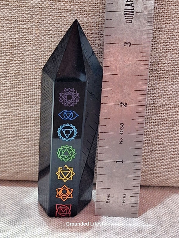polished black obsidian chakra point 3.50 inch with colored engravings