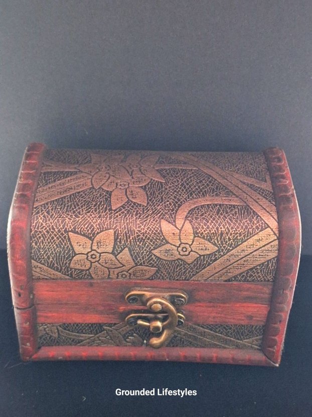 dinosaur skull high bounce balls shown in wooden treasure chest