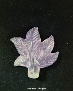 Polished purple fluorite gemstone leaf carving