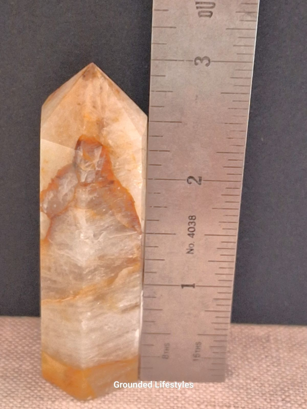 polished golden healer quartz point 3 inch showing iron inclusions