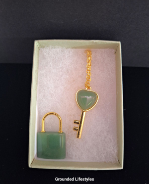 gold plated green aventurine key necklace shown in gift box
