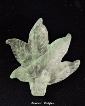Polished green fluorite gemstone leaf carving