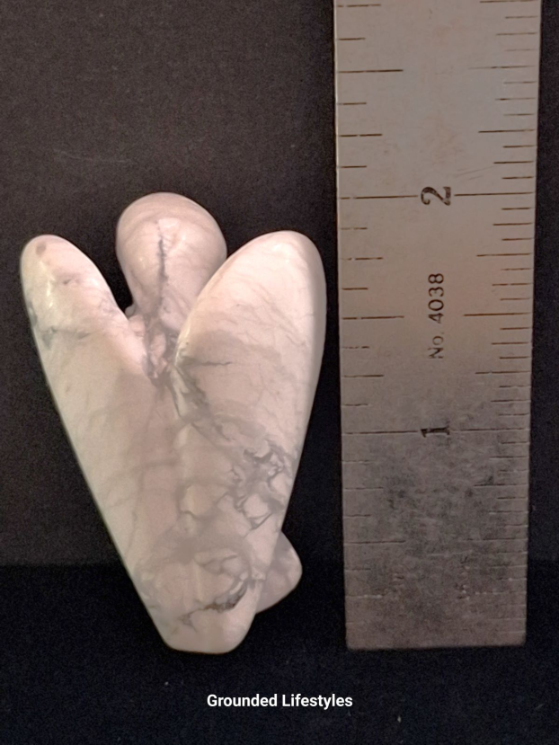 natural howlite angel carving white and gray marble-like gemstone