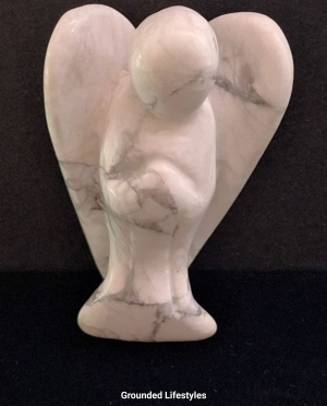 natural howlite angel carving white and gray marble-like gemstone
