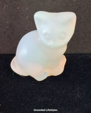 polished opalite cat miniature with glowing white and blue tones