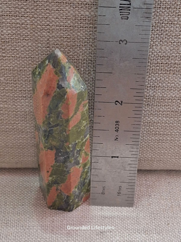 polished unakite 3.25 inch point showing natural granite patterns