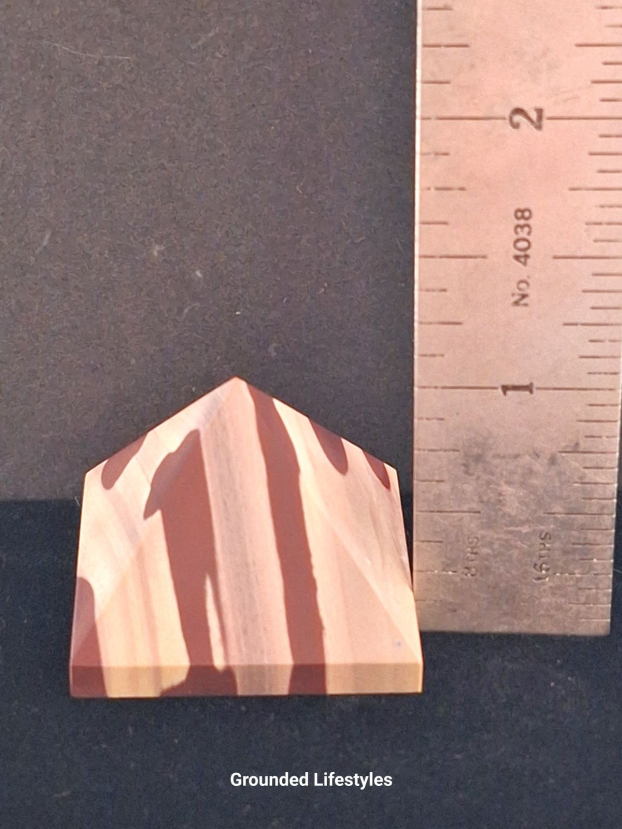 natural zebra stone pyramid 1.25 inch showing red and cream stripes